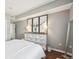 Bedroom featuring a dresser with an elegant black and white design and an accent mirror at 2700 E Cherry Creek South Dr # 216, Denver, CO 80209