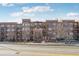 Beautiful brick apartment building with a grand entrance and private balconies at 2700 E Cherry Creek South Dr # 216, Denver, CO 80209