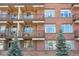 Apartment building with windows and balconies showing outdoor furniture for residents at 2700 E Cherry Creek South Dr # 216, Denver, CO 80209