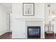Close-up of the fireplace with tile surround and a decorative mantel at 2700 E Cherry Creek South Dr # 216, Denver, CO 80209