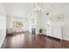 Bright living room featuring wood floors, large window, fireplace, and modern decor at 2700 E Cherry Creek South Dr # 216, Denver, CO 80209