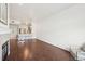 Spacious living space with wood flooring, fireplace, and an open view of the kitchen at 2700 E Cherry Creek South Dr # 216, Denver, CO 80209