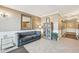 Inviting lobby area with a comfortable couch, decorative mirror, and stylish furnishings at 2700 E Cherry Creek South Dr # 216, Denver, CO 80209