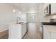 Modern kitchen with stainless steel appliances and a center island at 453 Interlocken Blvd # 103, Broomfield, CO 80021