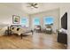 Main bedroom with wood floors and scenic views at 5585 Country Club Dr, Larkspur, CO 80118