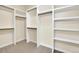 Large walk-in closet with shelving and hanging rods at 5585 Country Club Dr, Larkspur, CO 80118