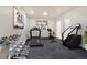 In-home gym featuring exercise equipment and plenty of space for a workout at 5585 Country Club Dr, Larkspur, CO 80118