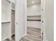 Laundry room with built-in cabinets and storage at 5585 Country Club Dr, Larkspur, CO 80118