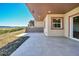 Large patio with hilltop views and access to interior at 5585 Country Club Dr, Larkspur, CO 80118