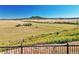 Scenic view of open fields and distant mountain at 5585 Country Club Dr, Larkspur, CO 80118