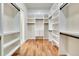 Large walk-in closet with ample shelving and rods at 5585 Country Club Dr, Larkspur, CO 80118