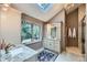 Bathroom featuring a skylight, granite countertops, double sinks, and a bright window view at 4856 Cheyenne Dr, Larkspur, CO 80118
