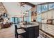Modern kitchen featuring granite counters, custom cabinetry, and stainless steel appliances at 4856 Cheyenne Dr, Larkspur, CO 80118