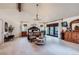 Spacious main bedroom featuring a high ceiling, chandelier, sitting area, and large windows at 4856 Cheyenne Dr, Larkspur, CO 80118