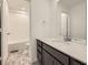 Bright bathroom features modern vanity with white countertop and stylish tile flooring at 4858 Astor Pl, Brighton, CO 80601