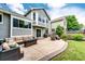 Enjoy a backyard with a large patio, outdoor seating, a grill, and a lush green lawn at 9846 Spring Hill Ln, Highlands Ranch, CO 80129