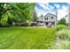 A spacious and well-maintained backyard featuring a lush lawn and inviting outdoor spaces at 9846 Spring Hill Ln, Highlands Ranch, CO 80129