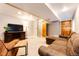 Cozy finished basement perfect for recreation and entertaining, featuring recessed lighting and comfortable seating at 9846 Spring Hill Ln, Highlands Ranch, CO 80129