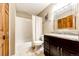 Bathroom features a shower/tub combination and a granite vanity sink at 9846 Spring Hill Ln, Highlands Ranch, CO 80129