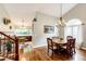Elegant dining room with hardwood floors, a chandelier, and adjacent living spaces at 9846 Spring Hill Ln, Highlands Ranch, CO 80129