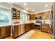 Modern kitchen with stainless steel appliances, granite countertops, and wood cabinetry at 9846 Spring Hill Ln, Highlands Ranch, CO 80129