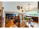 Open eat-in kitchen with an adjacent living room and beautiful hardwood floors at 9846 Spring Hill Ln, Highlands Ranch, CO 80129