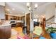 Modern kitchen features stainless steel appliances, wooden cabinets, and hardwood floors at 9846 Spring Hill Ln, Highlands Ranch, CO 80129