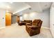 Finished basement featuring plush carpet and comfortable suede furniture at 9846 Spring Hill Ln, Highlands Ranch, CO 80129