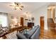 Inviting living room with hardwood floors, a ceiling fan, and stylish furnishings at 9846 Spring Hill Ln, Highlands Ranch, CO 80129