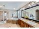 Spa-like bathroom with soaking tub, double vanity, and shower at 7395 Slate Ct, Castle Rock, CO 80108