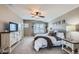 Main bedroom with carpeted floor, ceiling fan, and ensuite bathroom at 7395 Slate Ct, Castle Rock, CO 80108