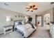 Main bedroom with carpeted floor, ceiling fan, and ensuite bathroom at 7395 Slate Ct, Castle Rock, CO 80108