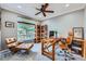 Functional home office with built-in shelving and a large window at 7395 Slate Ct, Castle Rock, CO 80108