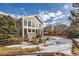 Back exterior view of house, showing patio and yard at 7395 Slate Ct, Castle Rock, CO 80108