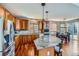 Gourmet kitchen featuring granite island, stainless steel appliances, and hardwood floors at 7395 Slate Ct, Castle Rock, CO 80108