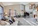 Bright living room featuring a grand piano, comfortable seating, and a high ceiling at 7395 Slate Ct, Castle Rock, CO 80108