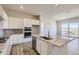 Bright kitchen with a center island, stainless steel appliances, and ample counter space at 14136 Bunny Hop Ln, Parker, CO 80134