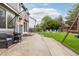 Spacious backyard with a patio, seating area, fire pit, and play set at 2763 Dharma Ave, Broomfield, CO 80020