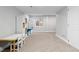 Finished basement area with neutral walls and carpet, has a window and is ready to be customized at 2763 Dharma Ave, Broomfield, CO 80020