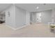 Finished basement area with neutral walls and carpet, with an adjacent bathroom at 2763 Dharma Ave, Broomfield, CO 80020