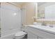 Bright bathroom featuring a tiled shower-tub, stylish vanity, and neutral decor at 2763 Dharma Ave, Broomfield, CO 80020