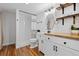 Nicely updated bathroom with tile shower, wood shelves and modern vanity at 2763 Dharma Ave, Broomfield, CO 80020