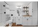 Charming bathroom features a modern vanity, wood shelves, and shower with eye-catching curtain at 2763 Dharma Ave, Broomfield, CO 80020