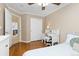 Bright bedroom boasts a built-in desk, a closet, and an open doorway, providing ample space and natural light at 2763 Dharma Ave, Broomfield, CO 80020