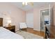 Comfortable bedroom showcases a plush chair, a window with backyard views, and a serene ambiance for relaxation at 2763 Dharma Ave, Broomfield, CO 80020