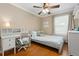 Inviting bedroom features a well-lit desk area, a cozy bed, and hardwood floors for a comfortable living space at 2763 Dharma Ave, Broomfield, CO 80020