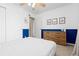 Comfortable bedroom with light carpet, a wooden dresser, and stylish wall decor at 2763 Dharma Ave, Broomfield, CO 80020