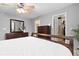 Bright bedroom featuring dresser storage and access to a walk-in closet and bathroom at 2763 Dharma Ave, Broomfield, CO 80020