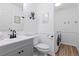 Convenient laundry room includes a modern washer and dryer, ample storage, and a stylish vanity with a sink at 2763 Dharma Ave, Broomfield, CO 80020