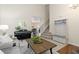 Open-concept living area with staircase, coat rack with bench, and seamless flow to the dining area at 2763 Dharma Ave, Broomfield, CO 80020